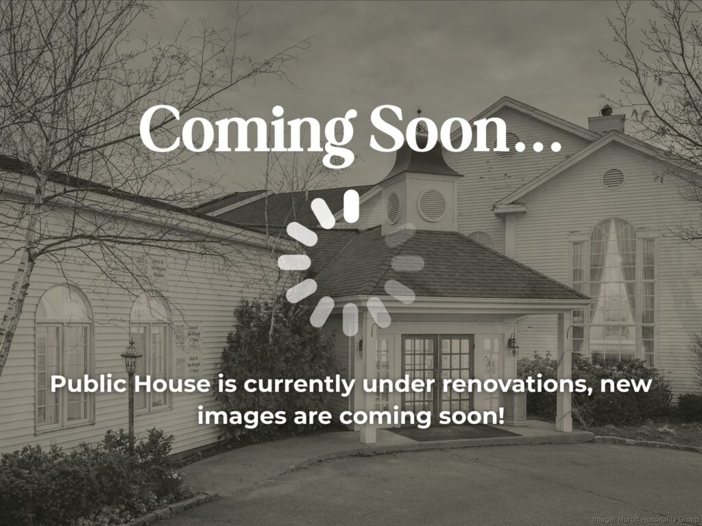 A grayscale image of a public house exterior with text overlay stating the location is under renovations and new images are coming soon.