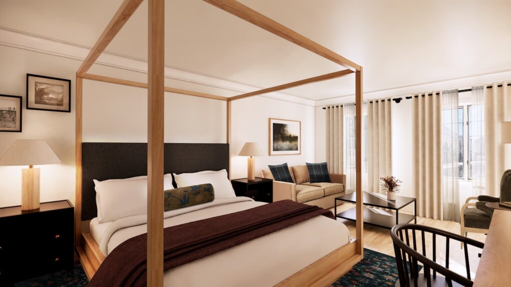 A hotel room with a wooden four-poster bed, white linens, bedside tables with lamps, a sofa, a glass coffee table, and large windows with curtains.